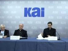 Archbishop Polak, center, at a press conference presenting a report on clerical abuse in Poland, June 28, 2021.
